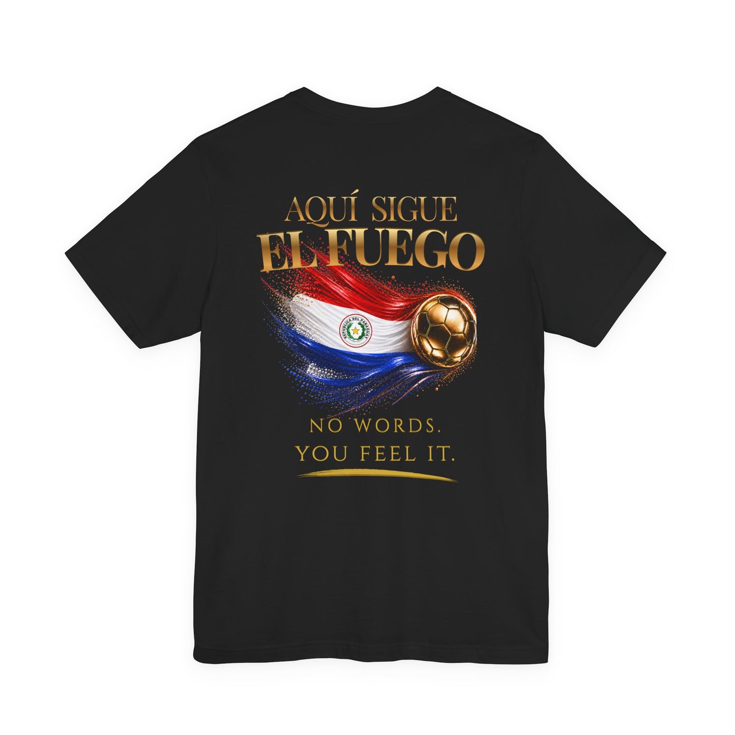 Back Print | Aquí Sigue El Fuego Tee | Gold Soccer & Paraguay Flag Design | Bilingual Edition