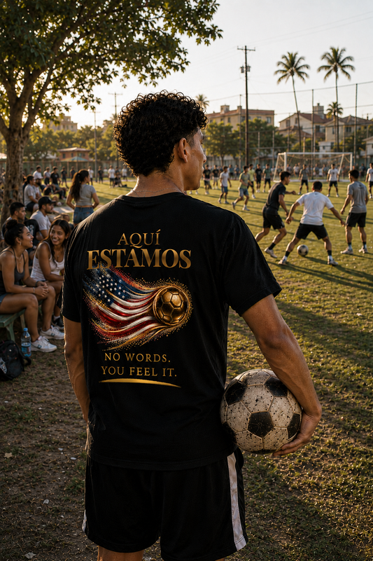 Back Print | Aquí Estamos Tee | Gold Soccer & United States Flag Design | Bilingual Edition